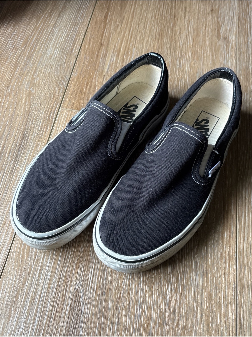 Vans Black and White Slip-On Canvas Sneakers